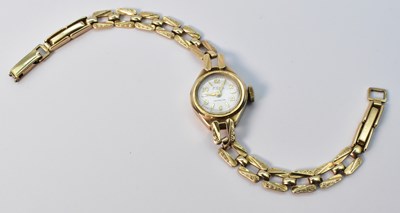 Lot 1030 - AVIA; a 9ct yellow gold lady's wristwatch, the...