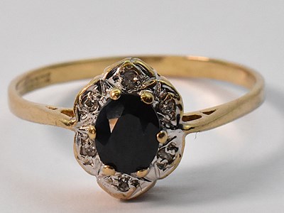 Lot 883 - A 9ct yellow gold dress ring with central...