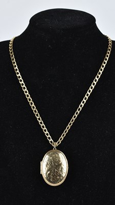 Lot 261 - A 9ct yellow gold oval locket with engraved...