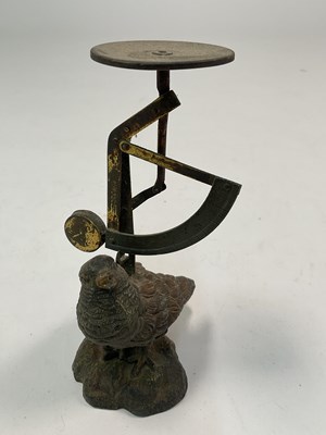 Lot 63 - A 2oz hinged scale mounted on a bird, height...