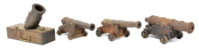 Lot 518 - Four cast iron models of cannon, the larger a...