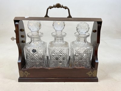 Lot 38 - A 20th century brass mounted three bottle...