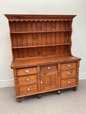 Lot 1217 - A late Victorian pine dresser base with later...