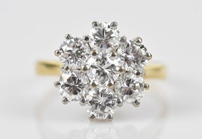Lot 372 - An 18ct yellow gold diamond seven stone daisy...