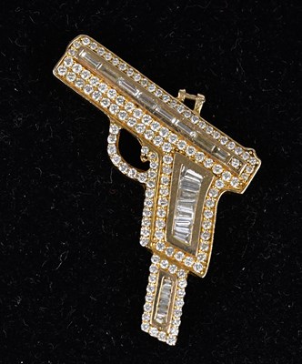 Lot 230 - A novelty yellow metal diamond set pendant...