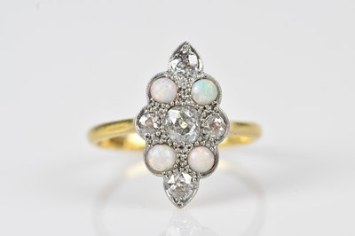 Lot 410 - An 18ct yellow gold and platinum lozenge...
