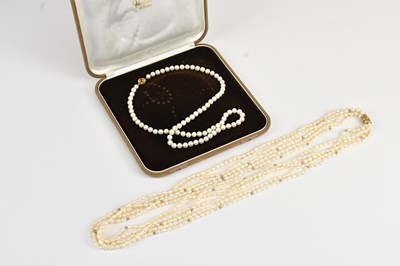 Lot 297 - A single strand cultured pearl necklace with...