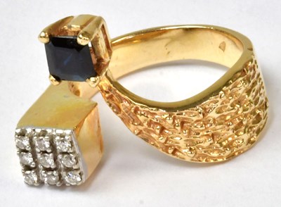 Lot 872 - A c.1970s yellow metal bark-effect open ring...
