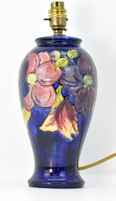 Lot 73 - MOORCROFT; a large table lamp of ovoid form,...