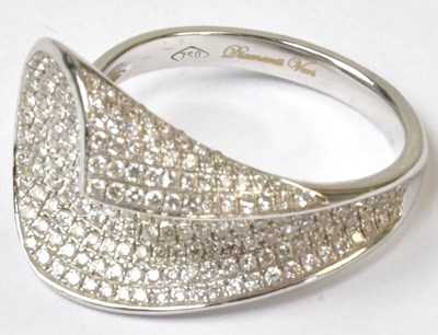 Lot 856 - An 18ct white gold abstract scroll ring pavé...