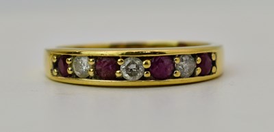 Lot 479 - An 18ct gold diamond and spinel seven stone...