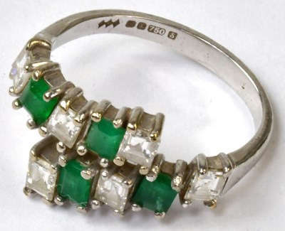Lot 865 - An 18ct white gold ring set with six diamonds...