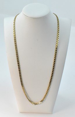 Lot 939 - A 9ct yellow gold flat curb necklace with...