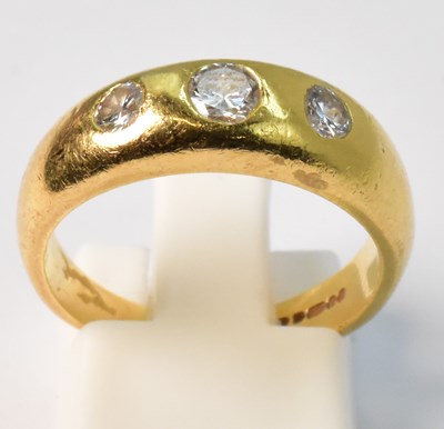Lot 857 - An 18ct yellow gold ring set with three gypsy...