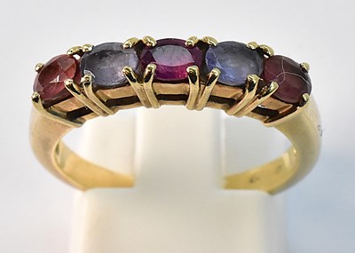 Lot 886 - A 9ct yellow gold dress ring with five close...