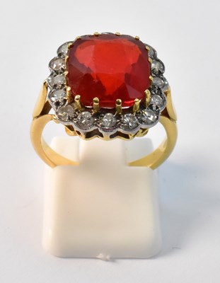 Lot 891 - A yellow gold dress ring with claw set cut...