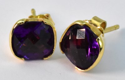 Lot 950 - A pair of 18ct yellow gold amethyst set stud...