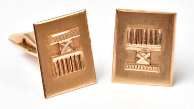 Lot 959 - A pair of yellow metal rectangular cufflinks...
