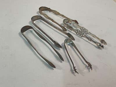 Lot 544 - A collection of five hallmarked silver sugar...