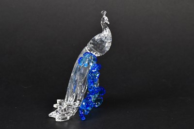 Lot 235 - SWAROVSKI; a crystal figure of a peacock,...