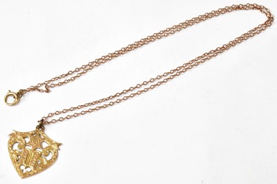Lot 927 - An 18ct yellow gold heart/shield-shaped...