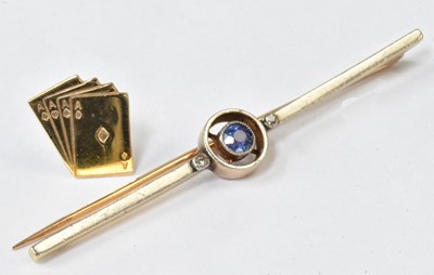 Lot 912 - An Edwardian yellow metal bar brooch set with...