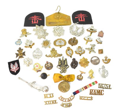 Lot 683 - A large quantity of various cap badges, medals,...