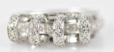 Lot 435 - A white metal diamond set broad ring, set with...