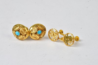 Lot 951 - A pair of Chinese yellow metal circular...