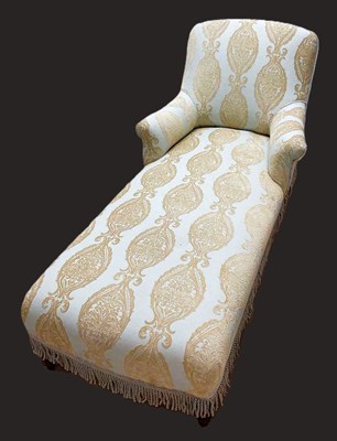 Lot 653 - A mahogany framed daybed upholstered in a...