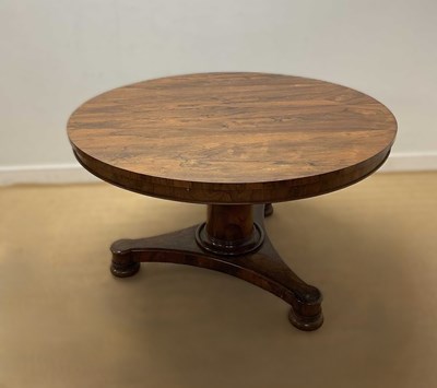 Lot 654 - A 19th century rosewood tilt-top table of...