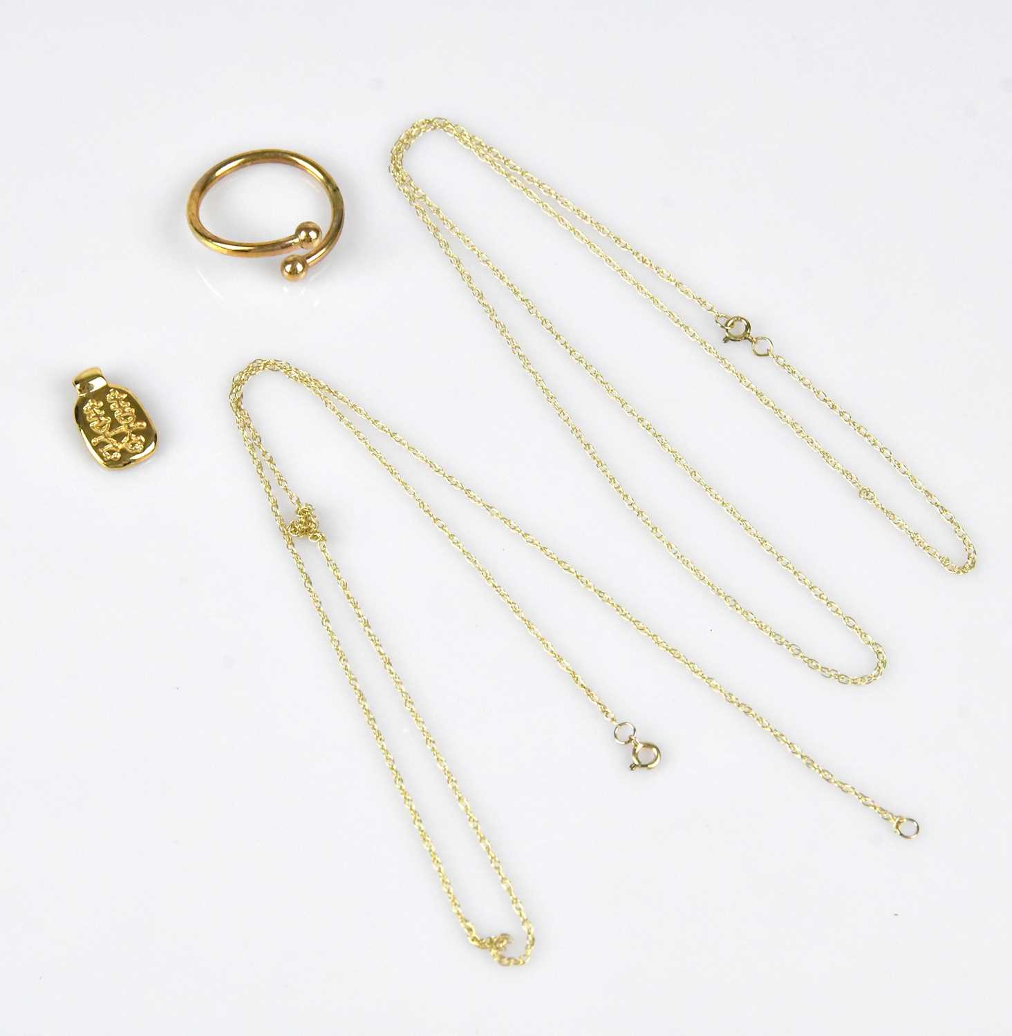 Lot 24 - A yellow metal Chinese pendant, a yellow metal...