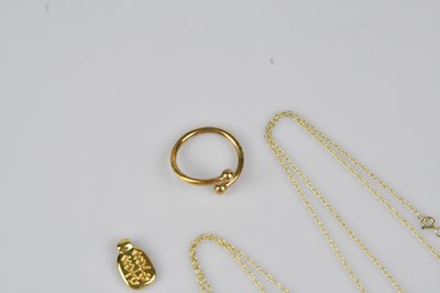 Lot 24 - A yellow metal Chinese pendant, a yellow metal...