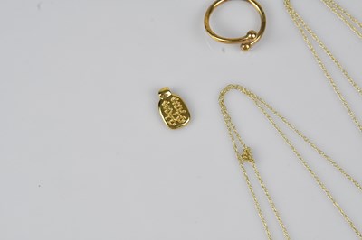 Lot 24 - A yellow metal Chinese pendant, a yellow metal...
