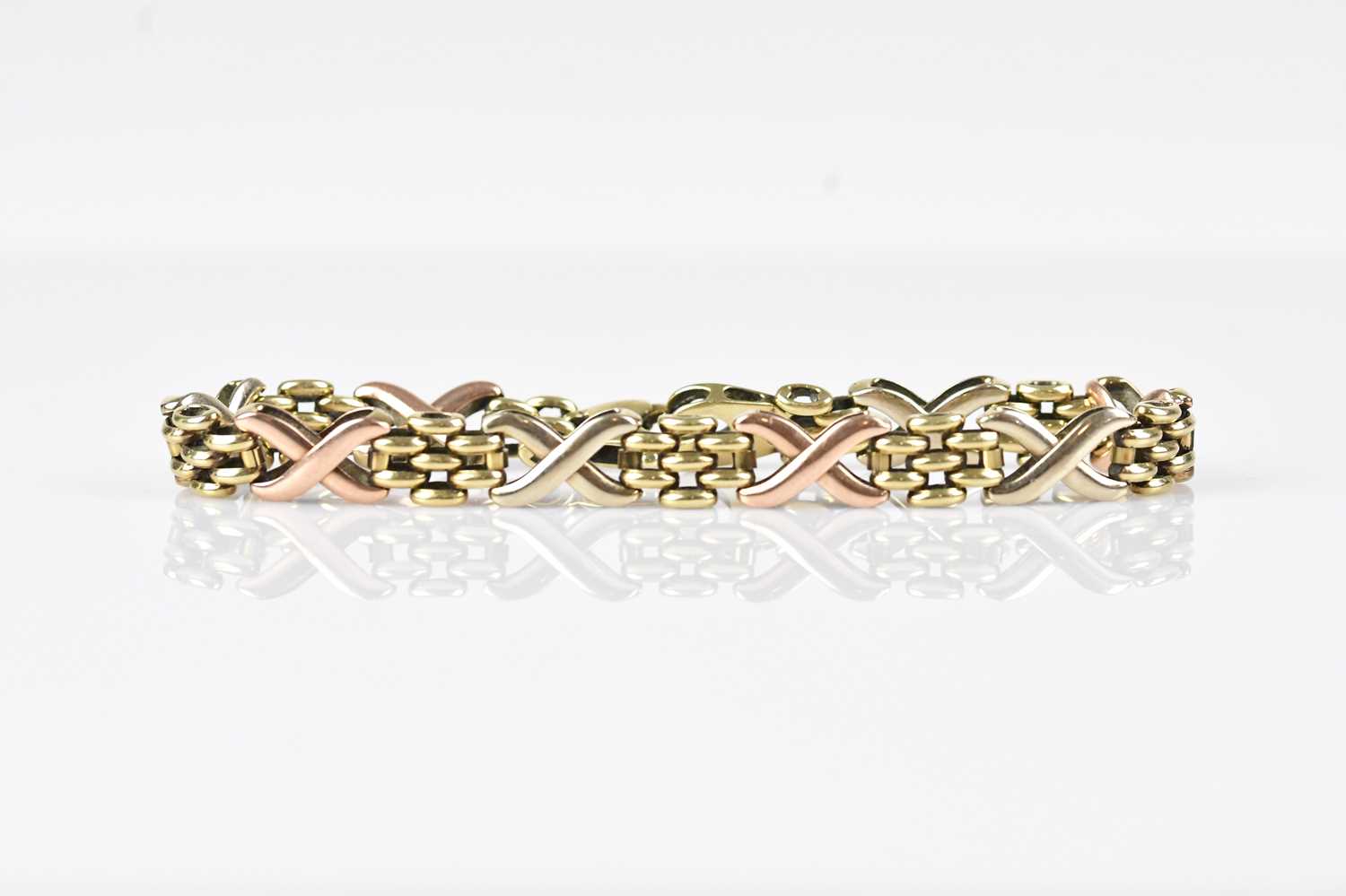 Lot 44 - A 9ct tricolour gold fancy link bracelet,...