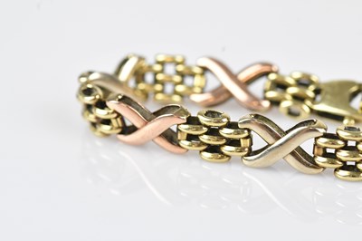 Lot 44 - A 9ct tricolour gold fancy link bracelet,...