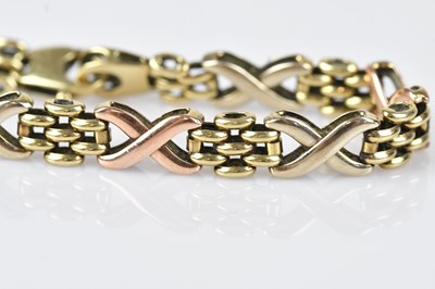 Lot 44 - A 9ct tricolour gold fancy link bracelet,...