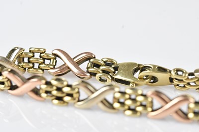 Lot 44 - A 9ct tricolour gold fancy link bracelet,...