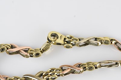 Lot 44 - A 9ct tricolour gold fancy link bracelet,...