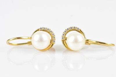 Lot 184 - A pair of yellow metal pearl set earrings,...