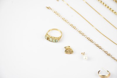 Lot 10 - A 9ct yellow gold opal set dress ring (one...