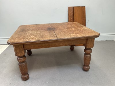Lot 1281 - A late Victorian oak wind-out extending dining...