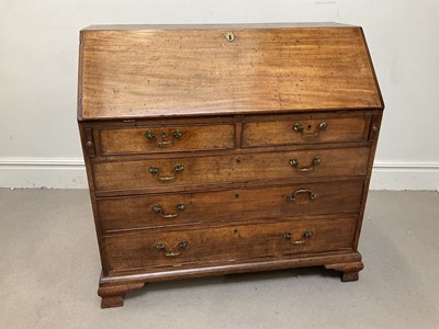 Lot 128 - A George III mahogany bureau, the fall front...