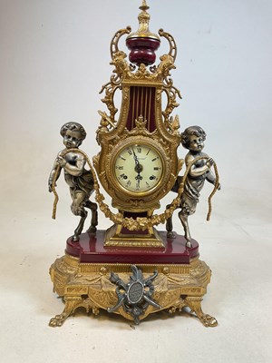 Lot 631 - A decorative contemporary lyre shaped gilt...
