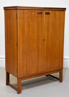 Lot 33 - TURNIDGE PRODUCT; a retro teak bar with...