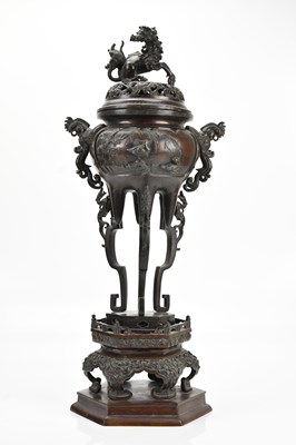 Lot 1641 - A Japanese bronze twin handled incense burner,...