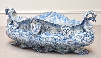Lot 1531 - A blue and white planter, decorated with...