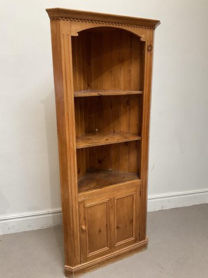Lot 135 - A pine free standing corner cabinet, with...