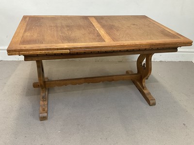 Lot 64 - An early 20th century oak extending refectory...
