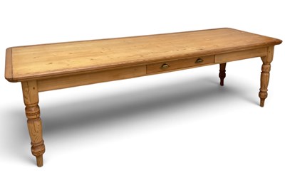 Lot 57 - A pitch pine farmhouse style dining table,...